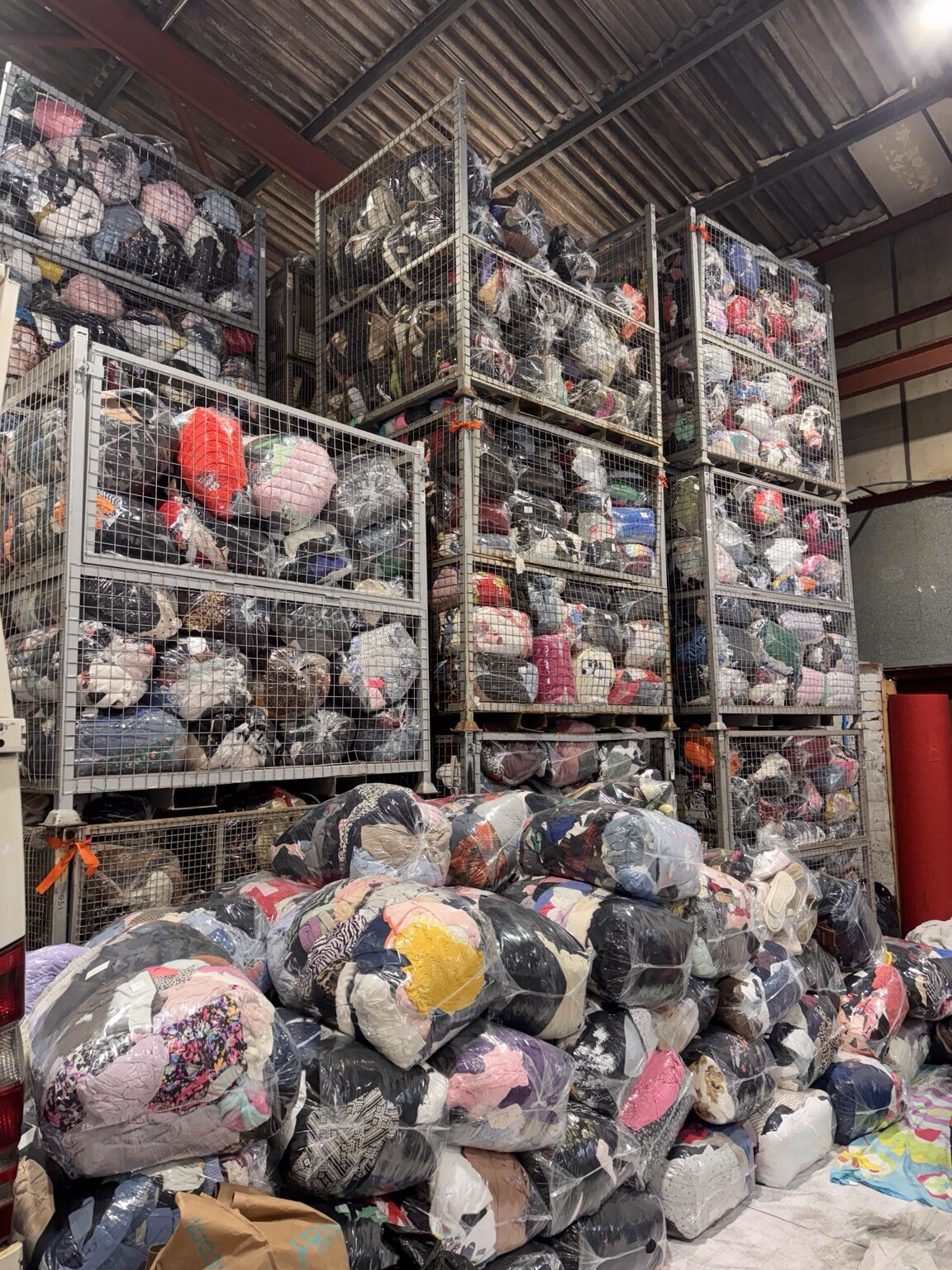 Wrapped clothing bags stored in metal cages