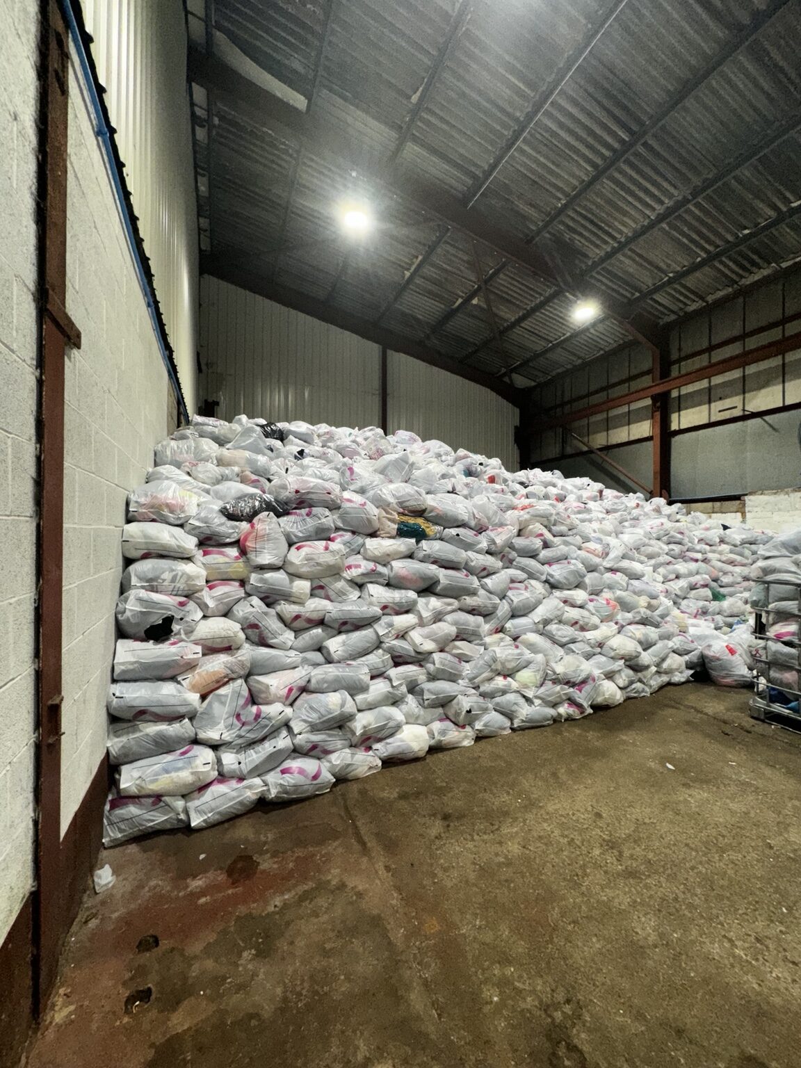 Collected clothing bags stored at the warehouse