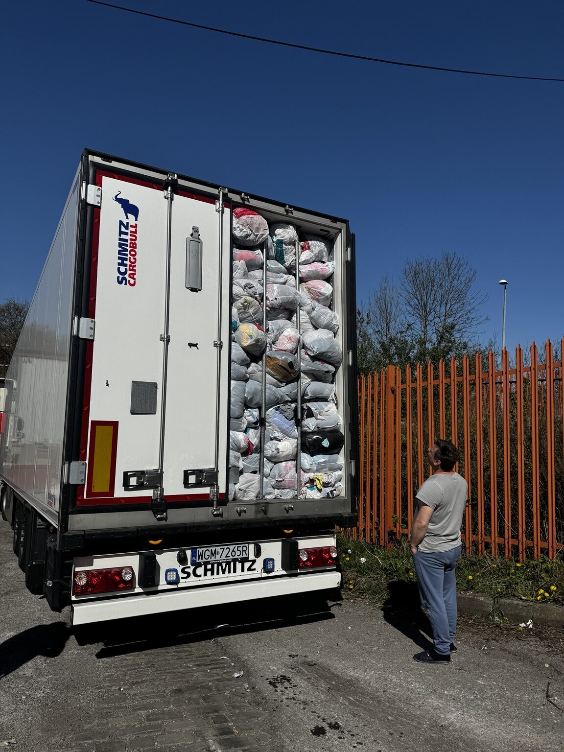 Truck packed with wrapped clothing bags