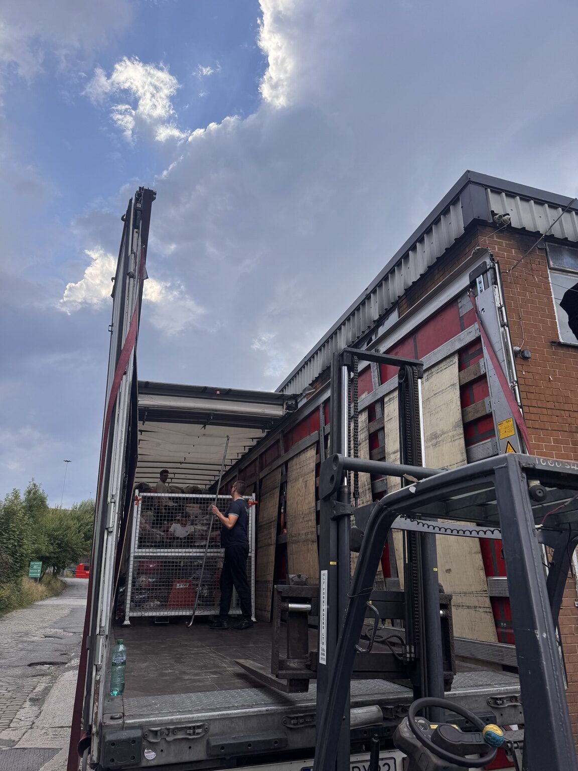 Clothing being loaded at the warehouse